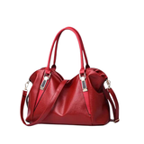 Stylish leather bag with double handles and shoulder strap