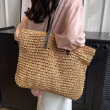 Woven carrier bag with leather straps