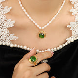 Noor - Elegant pearl necklace with green zircon pendant