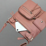 Leather shoulder bag with multiple compartments