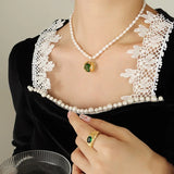 Noor - Elegant pearl necklace with green zircon pendant