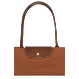 Brown handbag with a gold clasp on a white background